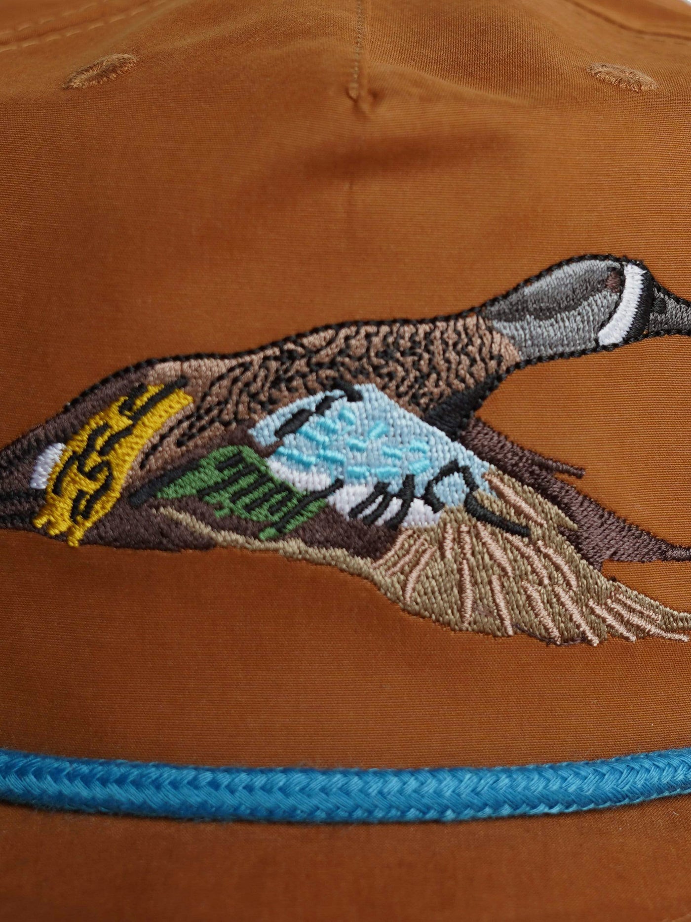 https://duckcamp.com/cdn/shop/files/Hats_BrownTeal_FlatLay_Embroidery_0054_1.jpg?v=1699382801&width=1400